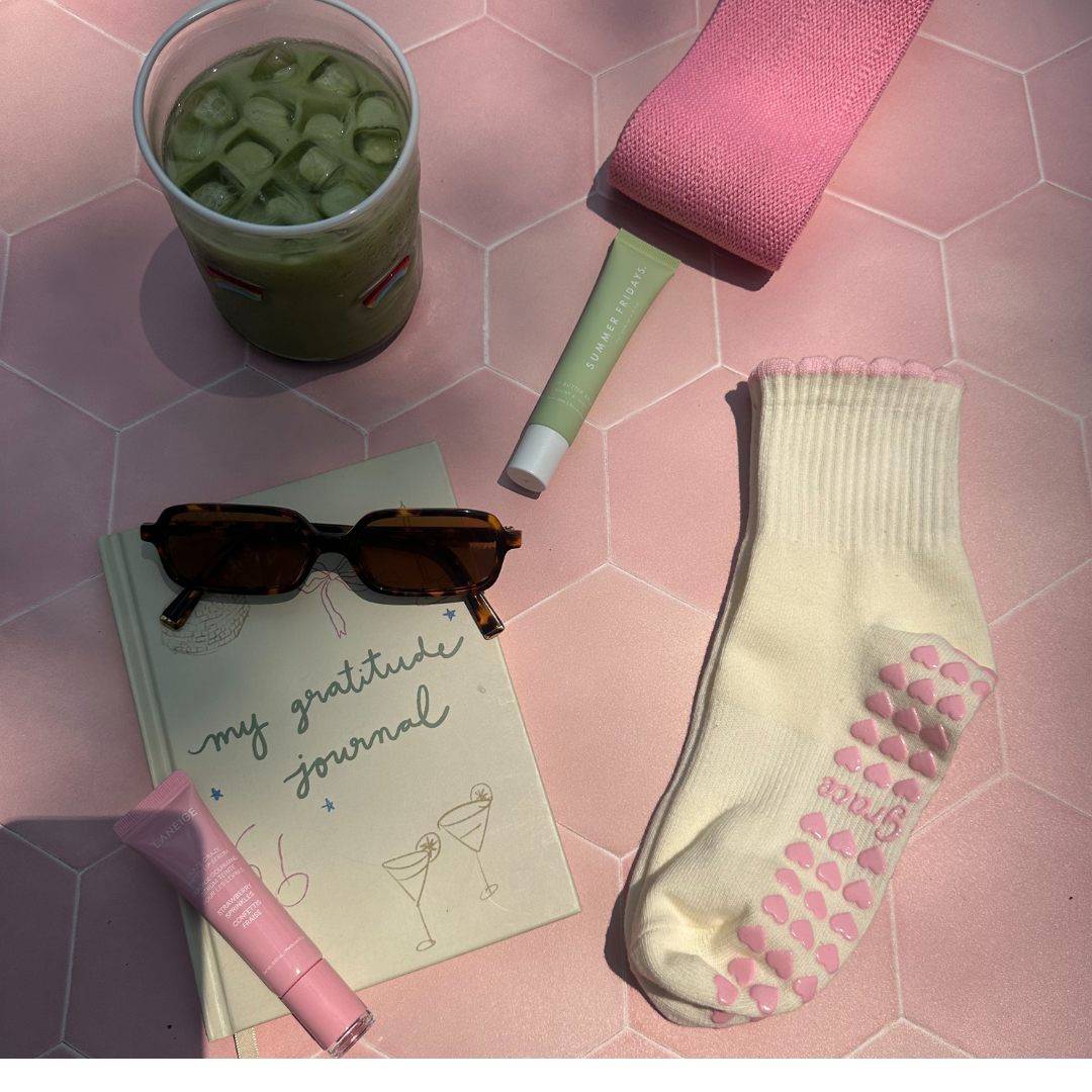 Cream sock with a pink ruffle and pink heart grips